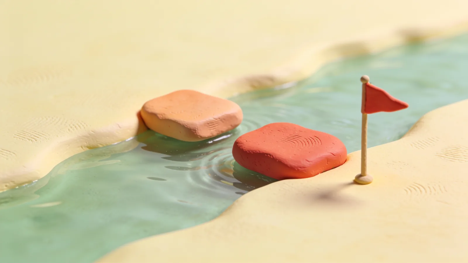 Clay illustration of two rounded stepping stones, one peach and one coral, crossing a calm green stream between sandy banks toward a small red flag